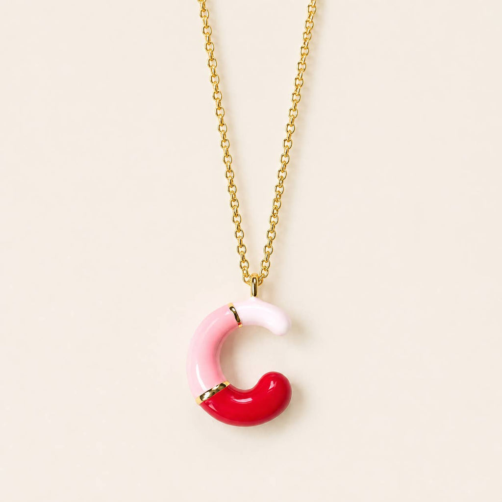 Pink, red and blush enamel C initial pendant necklace with polished gold-tone detailing.
