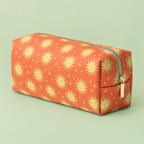 Terracotta celestial print vegan leather pouch with gold zip on a soft pale green background.