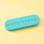 Mint green portable Sippy Straw case with gold lettering on a pale butter yellow background.