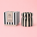 Cabana striped ceramic scented candle with colourful hand painted design.